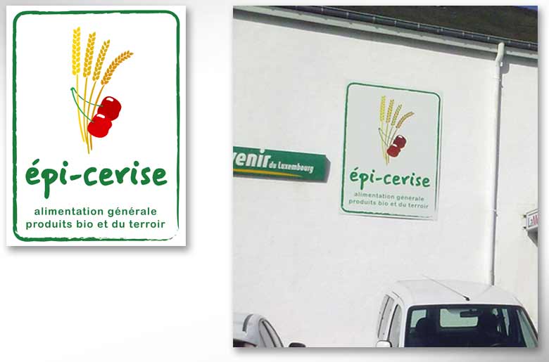 création d'un logo pour Epi-cerise, une épicerie qui vend des produits biologiques et du terroir. Le logo représente deux cerises entourant des épi de blé